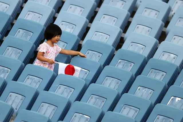 A child is seen in the stand during the Women's Group G match between New Zealand and Sweden on day four of the Tokyo 2020 Olympic Games at Miyagi Stadium on July 27, 2021 in Rifu, Miyagi, Japan. (Photo by Amr Abdallah Dalsh/Reuters)