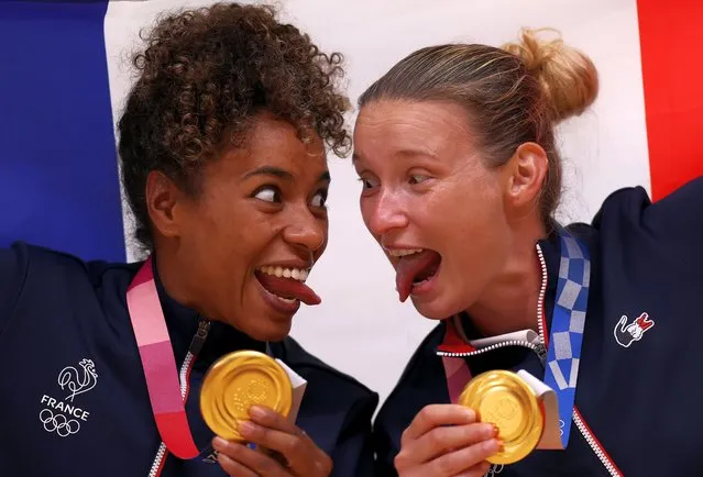 Estelle Nze Minko and Amandine Leynaud of Team France celebrate with their gold medals during the medal ceremony for Women's Handball on day sixteen of the Tokyo 2020 Olympic Games at Yoyogi National Stadium on August 08, 2021 in Tokyo, Japan. (Photo by Dean Mouhtaropoulos/Getty Images)