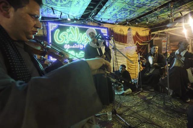 Musicians perform as they celebrate “Moulid Al-Hussein”, the birthday of Prophet Mohammad's grandson Hussein in Cairo, Egypt, February 10, 2016. (Photo by Mohamed Abd El Ghany/Reuters)