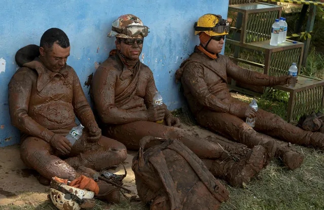 Members of a rescue team react upon returning from the mission, after a tailings dam owned by Brazilian mining company Vale SA collapsed, in Brumadinho, Brazil on January 28, 2019. (Photo by Washington Alves/Reuters)