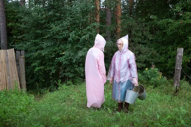 “Raincoats, 2013”. “Up until the age of twelve, I visited the village house every summer and stayed a month or longer. Back then, when my grandfather was still alive, his five children and their spouses would alternately use their vacation time to take care of him and the house. For me, coming from Saint Petersburg, it was a culture shock to find myself in the quiet of the small village, to follow a rigid schedule of meals and chores, and in the remainder of time to be left to run around freely through overgrown fields and forests”. (Photo by Nadia Sablin)