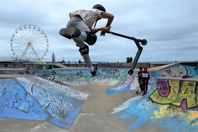 Young people enjoy a skate park in Le Havre, Northern France's Normandys region, on August 19, 2021. (Photo by Joel Saget/AFP Photo)