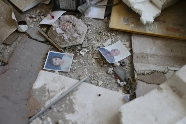 Pictures lie on the ground of a damaged house in the rebel-controlled area of Jobar, a suburb of Damascus, Syria March 3, 2016. (Photo by Bassam Khabieh/Reuters)