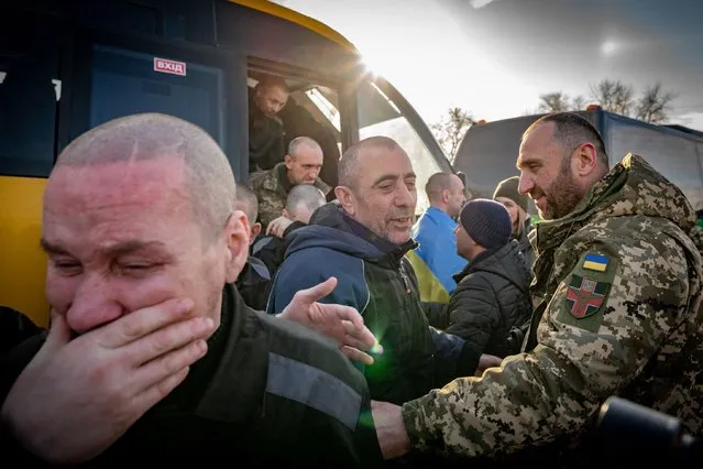 This handout photograph taken and released on January 31, 2024 by the Ukrainian presidential press service, shows Ukrainian former prisoners of war reacting following a prisoner exchange, amid Russia's military invasion on Ukraine. Russia and Ukraine exchanged hundreds of prisoners of war on January 31, just a week after Moscow said Kyiv had shot down a plane carrying dozens of captured Ukrainian soldiers. Russia's defence ministry said 195 of its soldiers were freed, while Ukrainian President Volodymyr Zelensky said 207 people -- both soldiers and prisoners – had returned to Ukraine. (Photo by Handout/Ukrainian Presidential Press Service via AFP Photo)