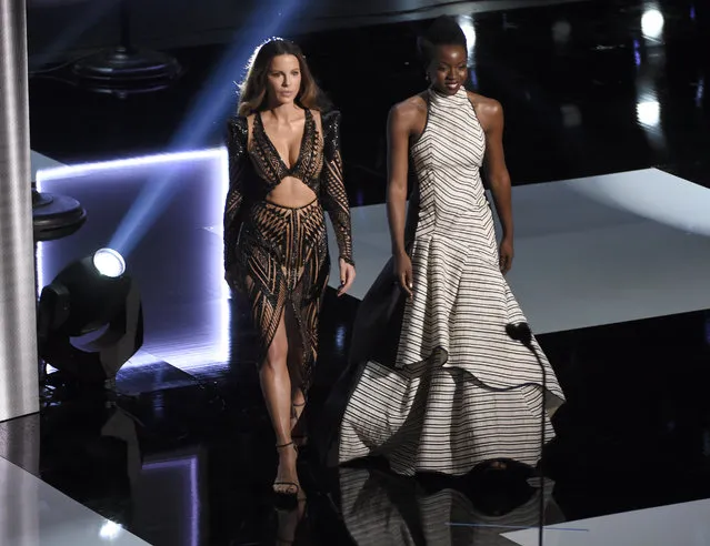Kate Beckinsale, left, and Danai Gurira walk on stage to present the award for outstanding actor in a motion picture at the 50th annual NAACP Image Awards on Saturday, March 30, 2019, at the Dolby Theatre in Los Angeles. (Photo by Chris Pizzello/Invision/AP Photo)