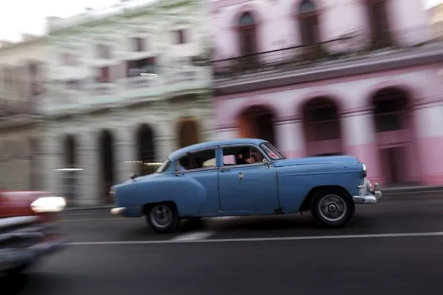 Vintage cars are seen on a street in Havana, March 17, 2016. (Photo by Ueslei Marcelino/Reuters)
