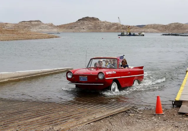 James Spear drives his German build 1964 Anphicar onto a boat launch and out of Lake Mead in Nevada as he takes his mother and cousins for a drive on the lake May 6, 2015. (Photo by Mike Blake/Reuters)