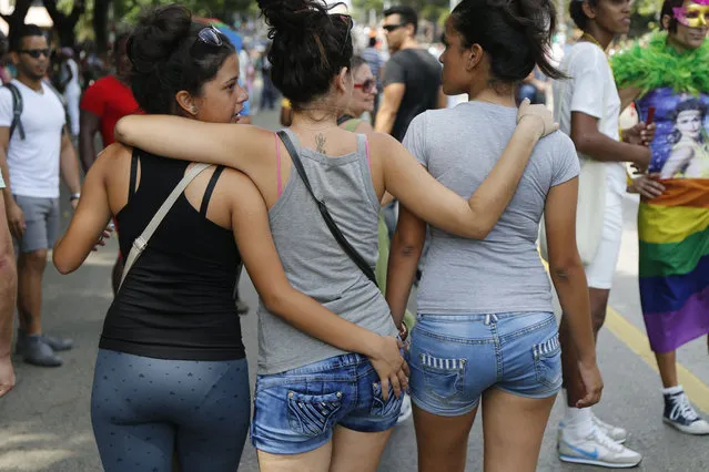 Members of Cuba's LGBT community take part in a gay pride parade in Havana, Cuba, Saturday, May 9, 2015. The event is part of official ceremonies leading up to the Global Day against Homophobia on May 17. (Photo by Desmond Boylan/AP Photo)