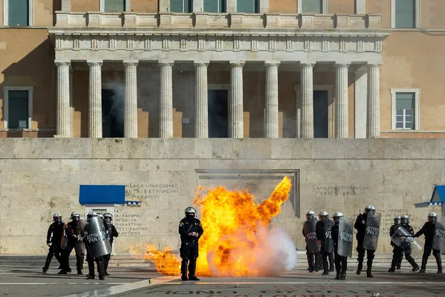 A petrol bomb explodes as Greek university students clash with riot police during a demonstration before the voting of a planned bill which opens the way for the operation of foreign private universities, in Athens, Greece, on March 8, 2024. (Photo by Alkis Konstantinidis/Reuters)