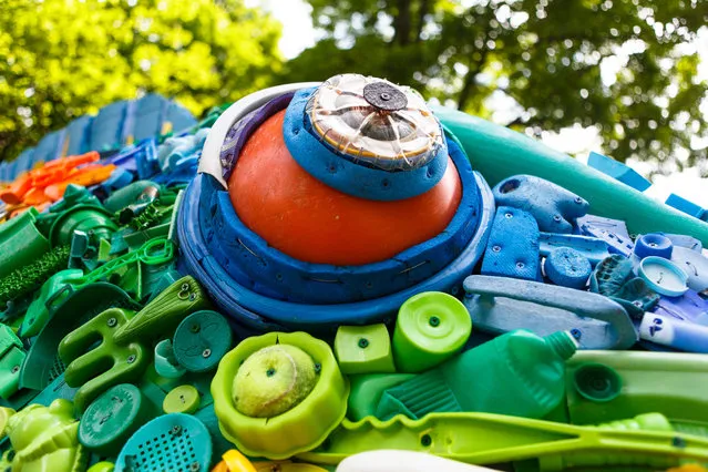 A parrotfish, made from debris from the world’s oceans, is part of a larger art project representing the some 315 billion pounds of trash currently found at sea. The fish, along with other ocean species, can be found at the National Zoo. (Photo by Keith Lane/The Washington Post)