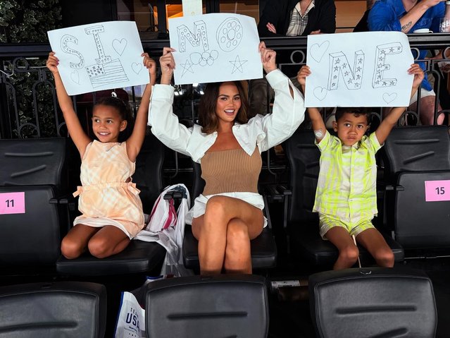 In Paris for the Olympics, American model Chrissy Teigen (center) with her kids Luna, 8, and Miles, 6, root for the US team and their favorite gymnast, Simone Biles early August 2024. (Photo by chrissy teigen/Instagram)