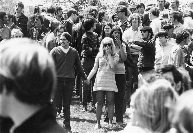 On Blanket Hill, Kent State University students, several with hands over their mouths, stare in the aftermath of the Ohio National Guard having opened fire on their antiwar demonstration, Kent, Ohio, May 4, 1970. Four protestors were eventually shot and killed (and nine injured) when troops began to fire their weapons into the crowd. (Photo by Howard Ruffner/Getty Images)