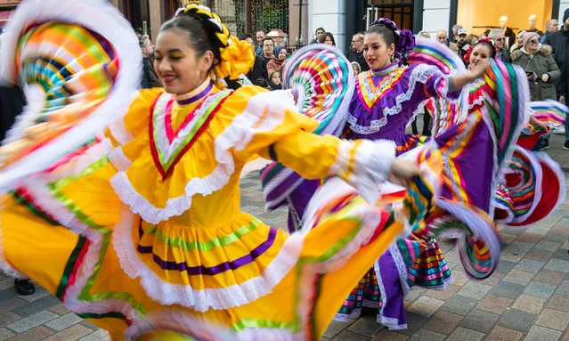 Dancers with the Carnaval del Pueblo, a group of performers from Latin and South America, during a preview of London New Year's Day Parade at the Covent Garden Piazza in London, England on December 30, 2019. (Photo by Dominic Lipinski/PA Images via Getty Images)