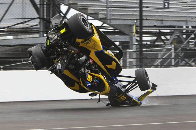 Colton Herta crashes in the first turn during the final practice for the Indianapolis 500 auto race at Indianapolis Motor Speedway in Indianapolis, Friday, May 27, 2022. (Photo by Joe Watts/AP Photo)