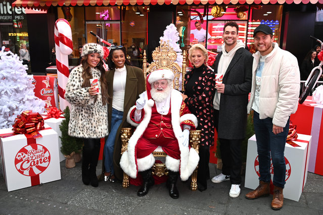 Bravo stars Dolores Catania, Ciara Miller, Santa Claus, Dorinda Medley, Jesse Solomon and Peter Weber attend as Lacey Chabert joins Raising Cane's Owner and Founder Todd Graves for a bike donation to Harlem Boys & Girls Club at Military Island, Times Square on December 10, 2024 in New York City. (Photo by Bryan Bedder/Getty Images for Raising Cane's)