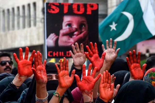 Protesters raise their hands painted in red during a demonstration to mark Kashmir Solidarity Day in Karachi on February 5, 2020. Pakistan observes Kashmir Solidarity Day on February 5, to express solidarity with their fellow Kashmiris living in Indian-administered Kashmir. (Photo by Asif Hassan/AFP Photo)