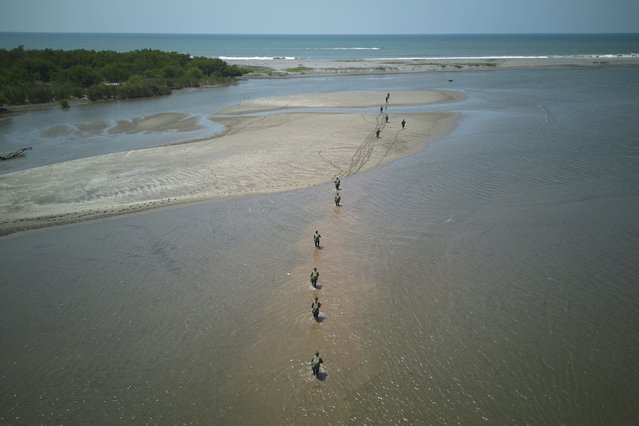 Guatemalan soldiers patrol the shared border with Mexico as part of the Ring of Fire operation, aiming to strengthen border control, at the mouth of Suchiate River in Ocos, Guatemala, Thursday, March 13, 2025. (Photo by Moises Castillo/AP Photo)