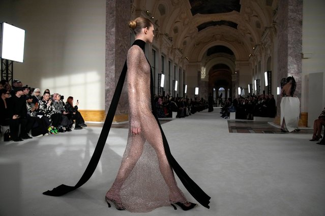 A model wears a creation for Schiaparelli's Haute Couture Spring-Summer 2024 collection presented in Paris, Monday, January 22, 2024. (Photo by Christophe Ena/AP Photo)