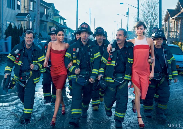 Models Chanel Iman and Karlie Kloss pose with the FDNY on Yanuary, 2013. (Photo by Annie Leibovitz/Vogue)