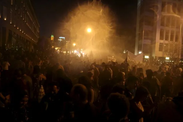 Protesters gather as security forces fire water cannons in Martyr square, downtown Beirut, Lebanon October 8, 2015. (Photo by Aziz Taher/Reuters)