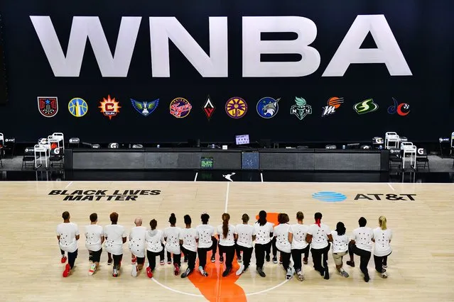 After the WNBA announcement of the postponed games for the evening, the Washington Mystics each wear white T-shirts with seven bullets on the back protesting the shooting of Jacob Blake by Kenosha, Wisconsin police at Feld Entertainment Center on August 26, 2020 in Palmetto, Florida. (Photo by Julio Aguilar/Getty Images)