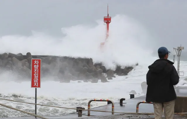 High waves crash against a breakwater at a port in Seogwipo, Jeju Island, South Korea, 02 September 2020, ahead of the arrival of Typhoon ​Maysak, which is projected to come close to the island the same day. (Photo by Yonhap/EPA/EFE)