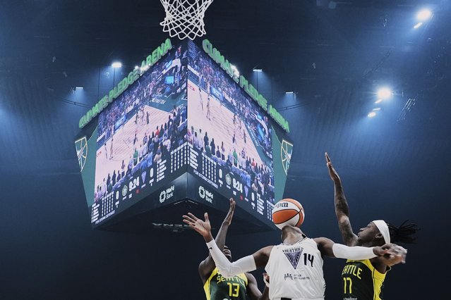 Golden State Valkyries center Temi Fagbenle (14) loses the ball against Seattle Storm forward Ezi Magbegor (13) and guard Erica Wheeler, right, during the first half of a WNBA basketball game Wednesday, July 16, 2025, in Seattle. (Photo by Lindsey Wasson/AP Photo)