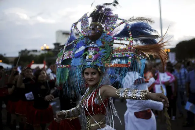 A dancer participates in a political rally of Guatemalan presidential candidate Jimmy Morales in downtown Guatemala City, October 22, 2015. Guatemalan citizens will vote in the second round of presidential elections on October 25. (Photo by Jose Cabezas/Reuters)