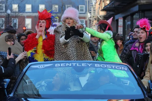 Actor Jennifer Coolidge is accompanied by HPT President Lyndsey Mugford (L) and Vice President of the Cast Nikita Hair during a parade through Harvard Square to honor Coolidge as Hasty Pudding Theatricals (HPT) Woman of the Year at Harvard University in Cambridge, Massachusetts, U.S., February 4, 2023. (Photo by Brian Snyder/Reuters)
