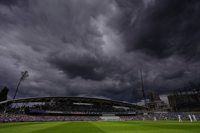 Dark clouds hover over the sky during the third day of the fifth cricket test match between England and India at The Kia Oval in London, Saturday, August 2, 2025. Left arm in a sling, face riven with agony, Chris Woakes could only look on helplessly from the far end. Mohammed Siraj detonated Gus Atkinson’s off-stump at 11.56am on Monday to seal a six-run triumph for India and end one of the most intense hours of Test cricket ever witnessed. (Photo by Kirsty Wigglesworth/AP Photo)