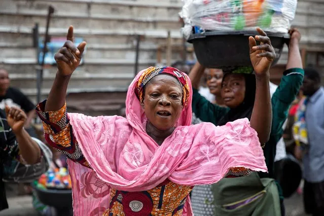 A woman dances in celebration of Bola Ahmed Tinubu's victory in an election, that has been disputed by opposition parties, in Lagos, Nigeria on March 1, 2023. (Photo by James Oatway/Reuters)