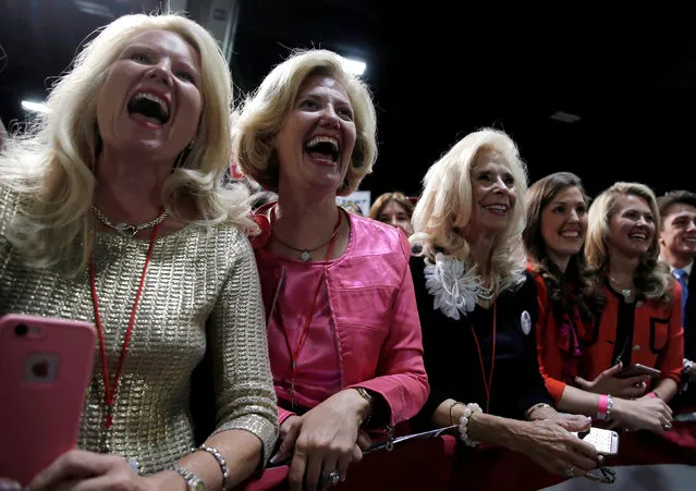 Supporters of Republican U.S. presidential nominee Donald Trump cheer as Trump takes the stage at a campaign rally in Charlotte, North Carolina, U.S., October 14, 2016. (Photo by Mike Segar/Reuters)