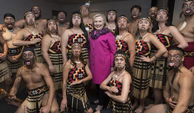 Hillary Clinton poses for a group photo with a Maori performing arts group called “Te Kapa Haka o Whangara Mai Tawhiti” who opened “An Evening with Hillary Rodham Clinton” at Spark Arena on May 7, 2018 in Auckland, New Zealand. The former US Secretary of State and Democratic presidential candidate, who lost the 2016 US election to Donald Trump, is touring Australia and New Zealand speaking about her life and career and being a woman in politics. (Photo by James D. Morgan/Getty Images)