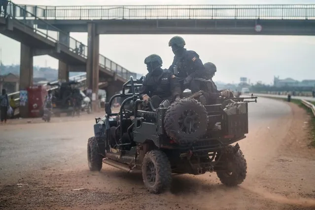 Security forces patrol the streets of Kampala, Uganda, Thursday, January 14, 2021.Ugandans are voting in a presidential election tainted by widespread violence that some fear could escalate as security forces try to stop supporters of leading opposition challenger Bobi Wine from monitoring polling stations. (Photo by Jerome Delay/AP Photo)