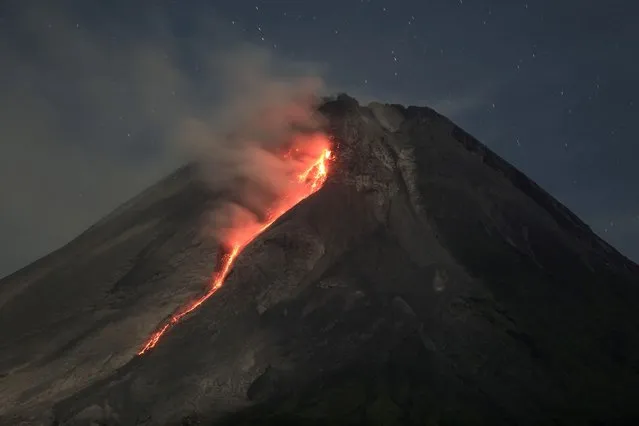 Mount Merapi volcano spews hot lava, as seen from Turi, in Sleman, Yogyakarta, Indonesia on March 13, 2023. (Photo by Hendra Nurdiyansyah/Antara Foto via Reuters)