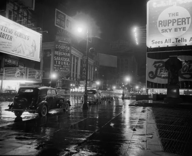 Theater marquees and illuminated outdoor display signs were turned off in Times Square in abeyance with Mayor William O'Dwyer's order of a wartime dimout in New York, February 7, 1946. O'Dwyer ordered the dimout to conserve the fuel supply had become very low due to a tugboat strike. (Photo by Matty Zimmerman/AP Photo)