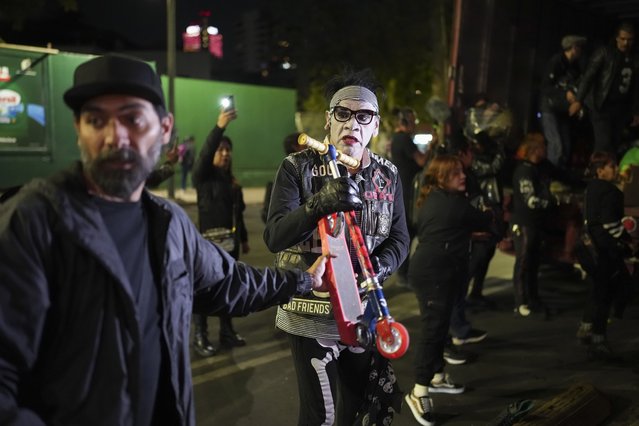 Volunteers known as The Punk Kings load a truck to distribute toys, clothes and piñatas to disadvantaged children in celebration of Día de los Reyes Magos or Three Kings Day, in Mexico City, January 5, 2025. (Photo by Eduardo Verdugo/AP Photo)