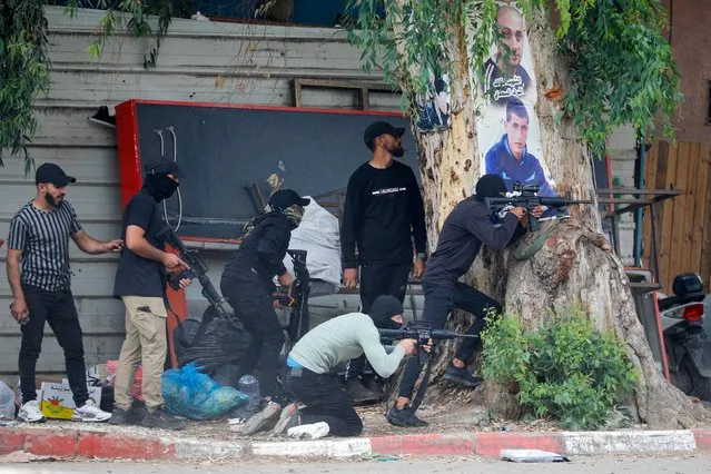 Palestinian gunmen clash with Israeli troops during an Israeli raid in Jenin, in the Israeli-occupied West Bank on June 19, 2023. (Photo by Raneen Sawafta/Reuters)