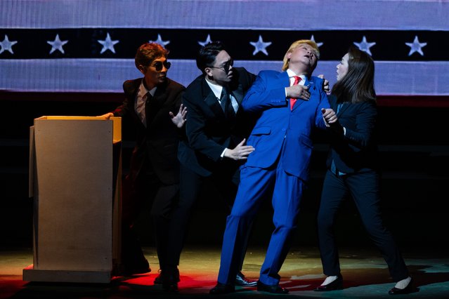 Actor Loong Koon Tin dressed as US President Donald Trump acts on stage during a Cantonese opera “Trump, The Twins President” on February 1, 2025 in Hong Kong, China. The Sunbeam Theatre, a cornerstone of Hong Kong's Cantonese opera scene for over 53 years, is set to close its doors on March 3, 2025, following its acquisition by the Island Evangelical Community Church. This closure has sparked deep emotional responses from the local community and artists, who view it as a significant loss to the cultural landscape, highlighting ongoing concerns about the preservation of Cantonese opera amid dwindling audiences and support for the arts. The theatre was famous for staging a wide variety of performances, including political satire. (Photo by Billy H.C. Kwok/Getty Images)
