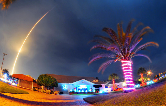 The SpaceX Falcon 9 rocket lifts off over Cocoa Beach, Fla., at Cape Canaveral Air Force Station, Monday, December 21, 2015. The rocket, carrying several communications satellites for Orbcomm, Inc., is the first launch of the rocket since a failed mission to the International Space Station in June. (Photo by Craig Rubadoux/Florida Today via AP Photo)