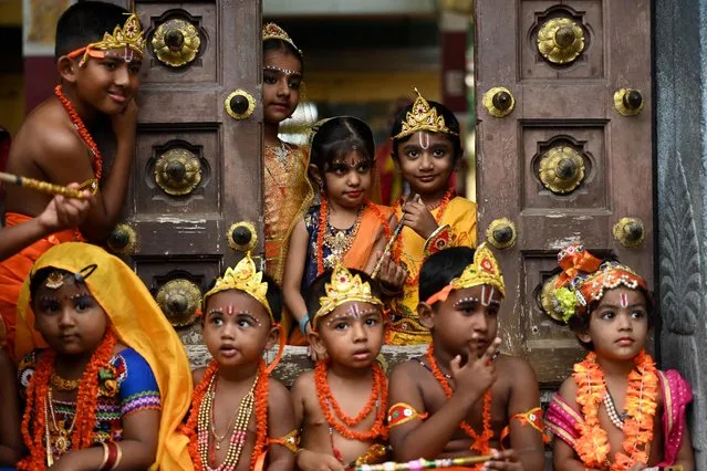 Children dressed as Hindu god Krishna and his consort Radha, take part in the celebrations on the eve of Janmashtami festival, which marks the birth of Lord Krishna, in Chennai on September 6, 2023. (Photo by R. Satish Babu/AFP Photo)