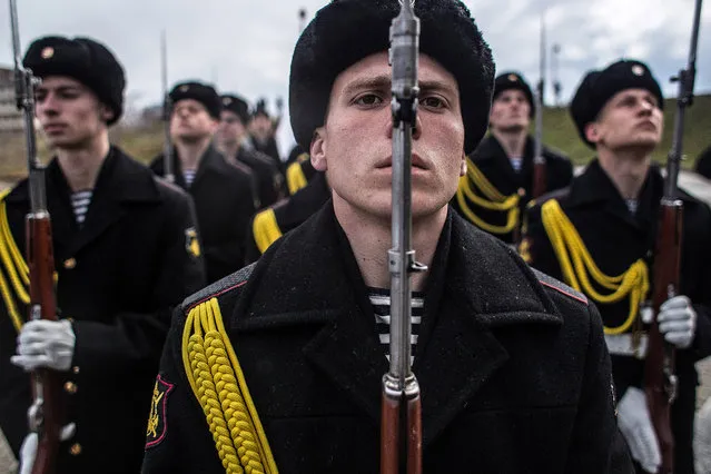 Soldiers of the honor guard prepare to march as people celebrate the first anniversary of the signing of the decree on the annexation of the Crimea by the Russian Federation, on March 18, 2015 in Sevastopol, Crimea. Crimea, an internationally recognised Ukrainian territory with special status, was annexed by the Russian Federation on March 18, 2014. The annexation, which has been widely condemned, took place in the aftermath of the Ukranian revolution. (Photo by Alexander Aksakov/Getty Images)