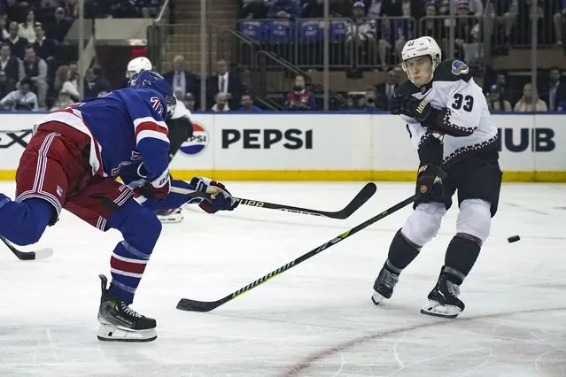 Arizona Coyotes' Travis Dermott, right, reacts as New York Rangers' Filip Chytil, left, slaps a shot past him during an NHL hockey game, Monday, October 16, 2023, in New York. (Photo by Bebeto Matthews/AP Photo)