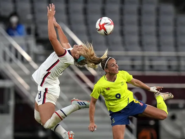 Midfielder Lindsey Horan (9) of Team United States and midfielder Kosovare Asllani (9) of Team Sweden go up for a header during the first round of the Tokyo 2020 Olympic Games at Tokyo Stadium on Wednesday, July 21. 2021. Sweden defeated the United States of America 3-0. (Photo by Toni L. Sandys/The Washington Post)