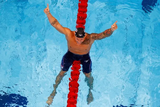 Caeleb Dressel of USA celebrates winning the Gold Medal in the 100m freestyle final on day six of the swimming competition of the Tokyo 2020 Olympic Games at Tokyo Aquatics Centre on July 28, 2021 in Tokyo, Japan. (Photo by Antonio Bronic/Reuters)