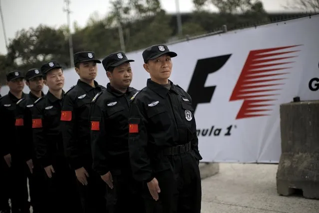 Security guards line up as they wait for instructions ahead of the Chinese F1 Grand Prix at the Shanghai International Circuit April 9, 2015. (Photo by Carlos Barria/Reuters)