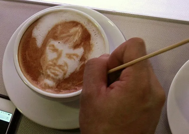 Coffee artist Zach Yonzon demonstrates making coffee latte art with a caricature of Filipino World Boxing Champion (WBC) Manny Pacquiao at Bunny Baker cafe in Manila April 9, 2015. Customers can request to have their coffee decorated with caricatures as part of the cafe's special service. Coffee prices ranges from P125 to P220 pesos ($2.84 to 4.88) per cup. (Photo by Romeo Ranoco/Reuters)