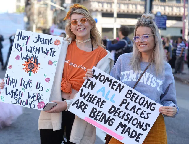 Demonstrators hold signs during the California-style Young Women's March on January 19, 2019  in Los Angeles. (Photo by Broadimage/Rex Features/Shutterstock)