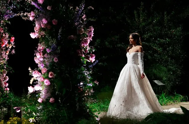 A model walks the runway at the “Bridgerton and Queen Charlotte: A Bridgerton Story” bridal collection from Allure Bridals in the Shakespeare garden of the Huntington library in San Marino, California, December 11, 2023. Bridalwear designer Allure Bridals announced its collaboration with Shondaland's hit Netflix series, Bridgerton and Queen Charlotte: A Bridgerton Story, and Emmy winning costume designer Lyn Paolo. (Photo by Michael Tran/AFP Photo)