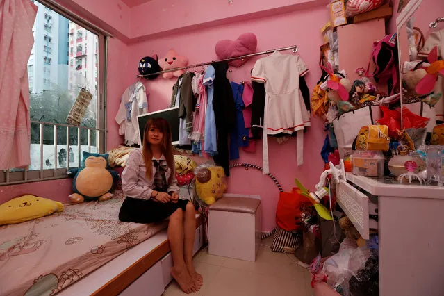 Manman Luk, a freelance model and make up artist, poses inside her 100-square-foot (9-square-metre) sub-divided unit, paying a monthly rent of HK4,700 ($606) in Hong Kong, China January 6, 2017. (Photo by Bobby Yip/Reuters)